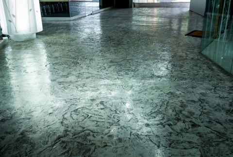 Polished and varnished concrete corridor floor with swirl marbled surface texture